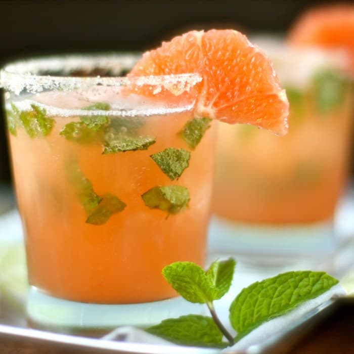 Arctic Fish cocktail in beer pilsner with orange twist
