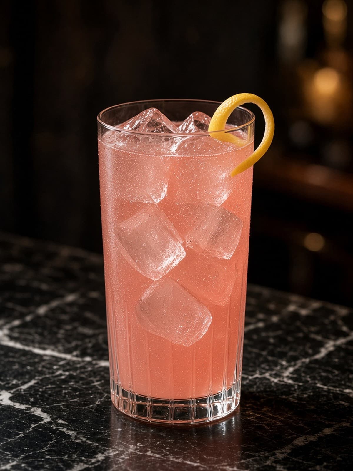 Cocchi Rosa Highball cocktail in highball with lemon wheel